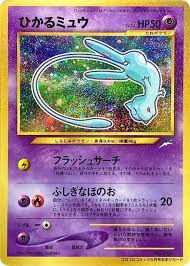 A Pokémon card featuring a holographic image of Mew, set against a colorful, sparkling background.